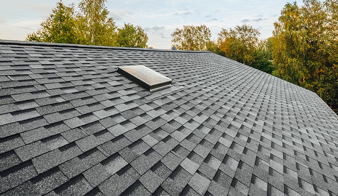 new renovated roof with shingles flat polymeric roof tiles