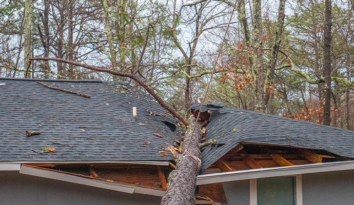storm damaged house roof in Granger